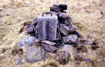 A balast weight, on top is a compass for scale.