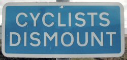 Cyclists Dismount sign