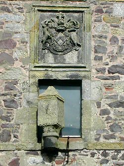 The sun dial and coat of arms